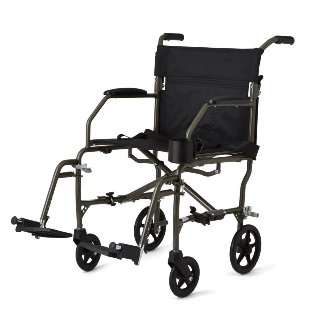 The Medline Ultralight Transport Chair, weighing just 15 lbs, features a durable aluminum frame with a black seat and armrests. It includes a cup holder on the right armrest, small wheels with front footrests, and its foldable design ensures easy mobility and transport.